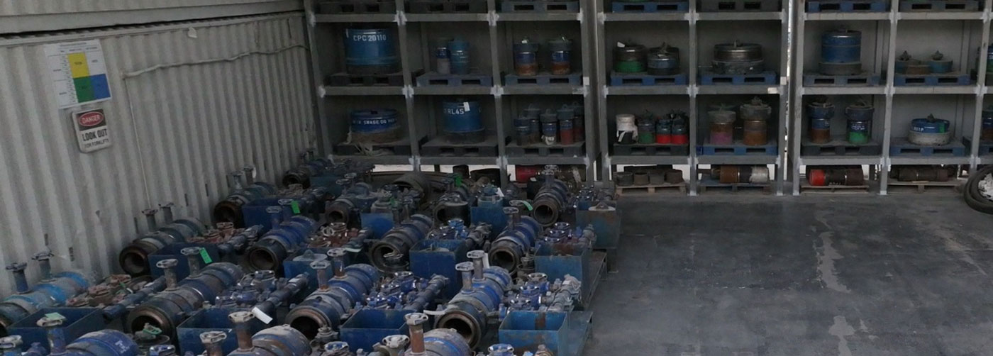 Cement heads and accessories stacked on shelves in a Superior Cementing warehouse