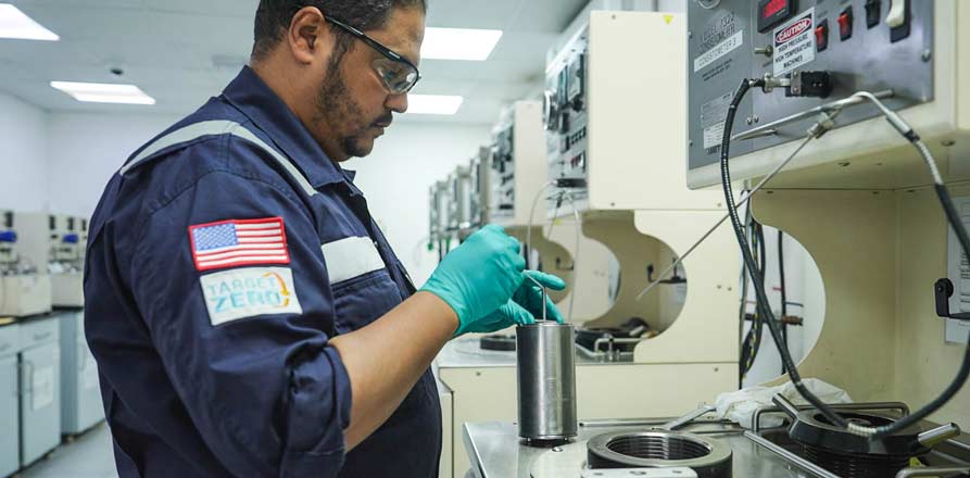 A Superior Cementing employee developing a new cementing solution at the Kuwait cementing facility